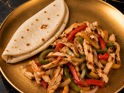 Chicken Faghita Plate cooked with Capsicum, Onions, corn served with Pita & avocado — Allow 30–60 Min Preparation