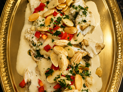Grilled Fish Fillet cooked with Tahini Sauce, Capsicum, Garlic, Lemon & Pine Nuts — Allow 30–60 Min Preparation