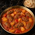 Grilled Meat cooked in Tomato Sauce w Potatoes Serve With Rice (Kafta)
